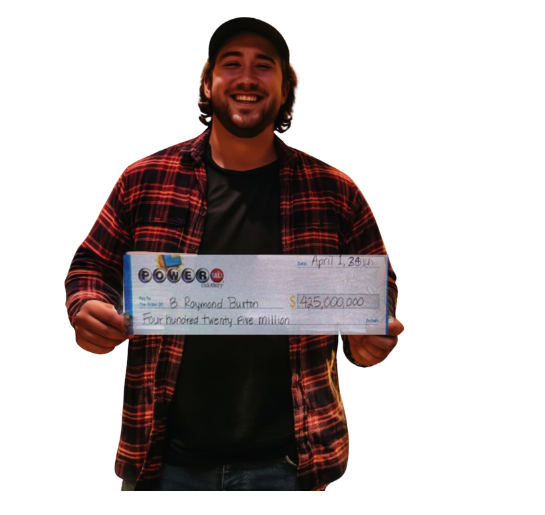 Man in lumberjack shirt holding a USA powerball cheque